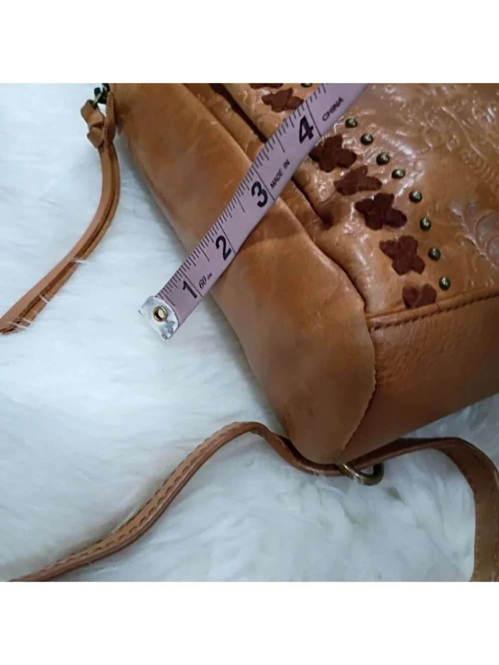 The Sak Brown Leather Embossed Convertible Backpack Purse Adjustable Straps